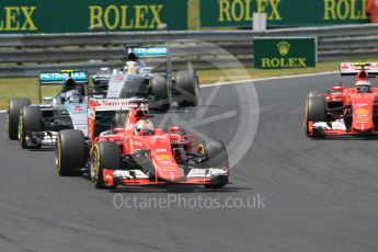 World © Octane Photographic Ltd. Scuderia Ferrari SF15-T– Sebastian Vettel and Kimi Raikkonen and Mercedes AMG Petronas F1 W06 Hybrid – Nico Rosberg and Lewis Hamilton. Sunday 26th July 2015, F1 Hungarian GP Race, Hungaroring, Hungary. Digital Ref: 1360CB1L7646