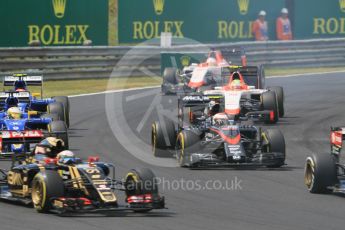 World © Octane Photographic Ltd. McLaren Honda MP4/30 - Jenson Button, Manor Marussia F1 Team MR03B – Roberto Merhi and William Stevens and Sauber F1 Team C34-Ferrari – Marcus Ericsson and Felipe Nasr. Sunday 26th July 2015, F1 Hungarian GP Race, Hungaroring, Hungary. Digital Ref: 1360CB1L7666