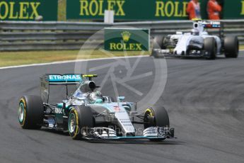World © Octane Photographic Ltd. Mercedes AMG Petronas F1 W06 Hybrid – Nico Rosberg and Williams Martini Racing FW37 – Valtteri Bottas. Sunday 26th July 2015, F1 Hungarian GP Race, Hungaroring, Hungary. Digital Ref: 1360CB1L7699