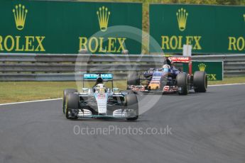 World © Octane Photographic Ltd. Mercedes AMG Petronas F1 W06 Hybrid – Lewis Hamilton and Scuderia Toro Rosso STR10 – Carlos Sainz Jnr. Sunday 26th July 2015, F1 Hungarian GP Race, Hungaroring, Hungary. Digital Ref: 1360CB1L7721