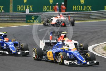 World © Octane Photographic Ltd. Manor Marussia F1 Team MR03B – Roberto Merhi and Sauber F1 Team C34-Ferrari – Marcus Ericsson and Felipe Nasr. Sunday 26th July 2015, F1 Hungarian GP Race, Hungaroring, Hungary. Digital Ref: 1360CB1L7746