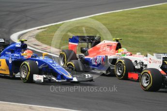 World © Octane Photographic Ltd. Manor Marussia F1 Team MR03B – Roberto Merhi and Sauber F1 Team C34-Ferrari – Felipe Nasr. Sunday 26th July 2015, F1 Hungarian GP Race, Hungaroring, Hungary. Digital Ref: 1360CB1L7749