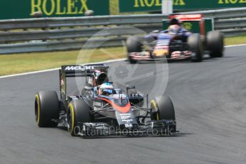 World © Octane Photographic Ltd. McLaren Honda MP4/30 – Fernando Alonso and Scuderia Toro Rosso STR10 – Max Verstappen. Sunday 26th July 2015, F1 Hungarian GP Race, Hungaroring, Hungary. Digital Ref: