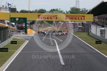 World © Octane Photographic Ltd. Off the line with the Scuderia Ferrari SF15-Ts of Sebastian Vettel and Kimi Raikkonen getting the jump on Mercedes. Sunday 26th July 2015, F1 Hungarian GP Race, Hungaroring, Hungary. Digital Ref: 1360LB1D2418