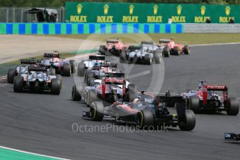 World © Octane Photographic Ltd. The pack clears turn 2. Sunday 26th July 2015, F1 Hungarian GP Race, Hungaroring, Hungary. Digital Ref: 1360LB1D2481