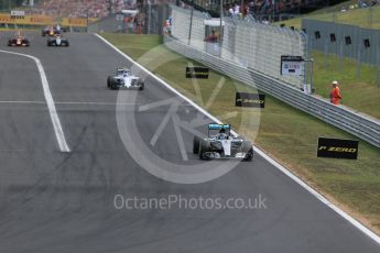 World © Octane Photographic Ltd. Mercedes AMG Petronas F1 W06 Hybrid – Nico Rosberg and Williams Martini Racing FW37 – Valtteri Bottas. Sunday 26th July 2015, F1 Hungarian GP Race, Hungaroring, Hungary. Digital Ref: 1360LB1D2523