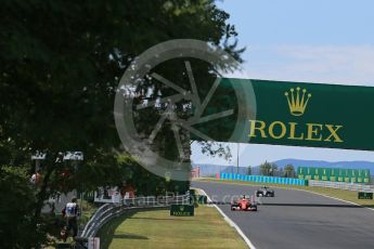 World © Octane Photographic Ltd. Scuderia Ferrari SF15-T– Sebastian Vettel and Mercedes AMG Petronas F1 W06 Hybrid – Nico Rosberg. Sunday 26th July 2015, F1 Hungarian GP Race, Hungaroring, Hungary. Digital Ref: