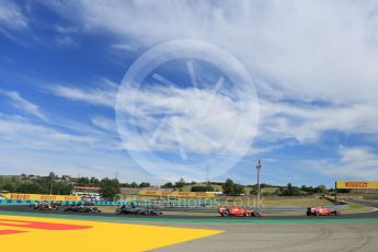 World © Octane Photographic Ltd. Scuderia Ferrari SF15-T– Sebastian Vettel and Kimi Raikkonen lead Mercedes AMG Petronas F1 W06 Hybrid – Nico Rosberg and Lewis Hamilton. Sunday 26th July 2015, F1 Hungarian GP Race, Hungaroring, Hungary. Digital Ref: