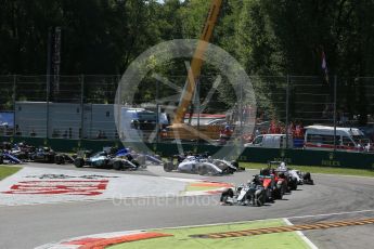 World © Octane Photographic Ltd. Mercedes AMG Petronas F1 W06 Hybrid – Lewis Hamilton leads the Scuderia Ferrari SF15-T of Sebastian Vettel into the 1st chicane. Sunday 6th September 2015, F1 Italian GP Race, Monza, Italy. Digital Ref: 1419LB1D2640