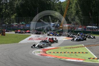 World © Octane Photographic Ltd. Mercedes AMG Petronas F1 W06 Hybrid – Lewis Hamilton leads the Scuderia Ferrari SF15-T of Sebastian Vettel into the 1st chicane. Sunday 6th September 2015, F1 Italian GP Race, Monza, Italy. Digital Ref: 1419LB1D2645