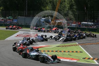 World © Octane Photographic Ltd. Mercedes AMG Petronas F1 W06 Hybrid – Lewis Hamilton leads the Scuderia Ferrari SF15-T of Sebastian Vettel into the 1st chicane. Sunday 6th September 2015, F1 Italian GP Race, Monza, Italy. Digital Ref: 1419LB1D2655