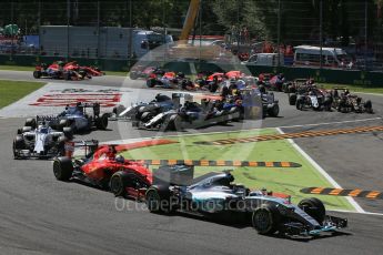 World © Octane Photographic Ltd. Mercedes AMG Petronas F1 W06 Hybrid – Lewis Hamilton leads the Scuderia Ferrari SF15-T of Sebastian Vettel into the 1st chicane. Sunday 6th September 2015, F1 Italian GP Race, Monza, Italy. Digital Ref: 1419LB1D2658
