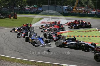 World © Octane Photographic Ltd. Loose debris as the pack works through the first chicane. Sunday 6th September 2015, F1 Italian GP Race, Monza, Italy. Digital Ref: 1419LB1D2678