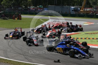 World © Octane Photographic Ltd. Loose debris as the pack works through the first chicane. Sunday 6th September 2015, F1 Italian GP Race, Monza, Italy. Digital Ref: 1419LB1D2682