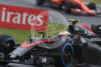 World © Octane Photographic Ltd. McLaren Honda MP4/30 - Jenson Button and Scuderia Ferrari SF15-T. Friday 25th September 2015, F1 Japanese Grand Prix, Practice 1, Suzuka. Digital Ref: