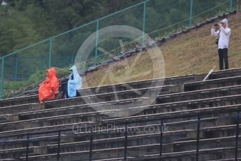 World © Octane Photographic Ltd. Fans in the rain. Friday 25th September 2015, F1 Japanese Grand Prix, Practice 1, Suzuka. Digital Ref: