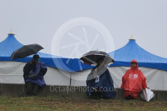 World © Octane Photographic Ltd. Fans in the rain. Friday 25th September 2015, F1 Japanese Grand Prix, Practice 1, Suzuka. Digital Ref: