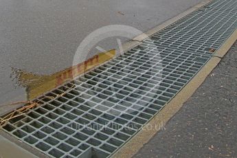World © Octane Photographic Ltd. Pirelli logo reflected in puddle. Friday 25th September 2015, F1 Japanese Grand Prix, Practice 2, Suzuka. Digital Ref: