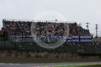 World © Octane Photographic Ltd. Grandstand with Heiki Kovalainen and Felipe Massa flags. Friday 25th September 2015, F1 Japanese Grand Prix, Practice 2, Suzuka. Digital Ref: