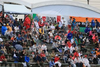 World © Octane Photographic Ltd. Fans in a wet open grandstand. Friday 25th September 2015, F1 Japanese Grand Prix, Practice 2, Suzuka. Digital Ref: