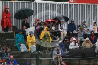 World © Octane Photographic Ltd. Fans with umbrellas. Friday 25th September 2015, F1 Japanese Grand Prix, Practice 2, Suzuka. Digital Ref: