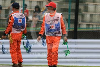 World © Octane Photographic Ltd. Marshals. Saturday 26th September 2015, F1 Japanese Grand Prix, Practice 3, Suzuka. Digital Ref: