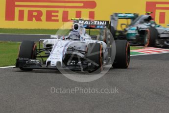 World © Octane Photographic Ltd. Williams Martini Racing FW37 – Valtteri Bottas and Mercedes AMG Petronas F1 W06 Hybrid – Nico Rosberg. Saturday 26th September 2015, F1 Japanese Grand Prix, Practice 3, Suzuka. Digital Ref: