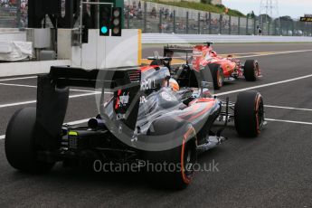 World © Octane Photographic Ltd. Scuderia Ferrari SF15-T– Kimi Raikkonen and McLaren Honda MP4/30 – Fernando Alonso. Saturday 26th September 2015, F1 Japanese Grand Prix, Practice 3, Suzuka. Digital Ref: