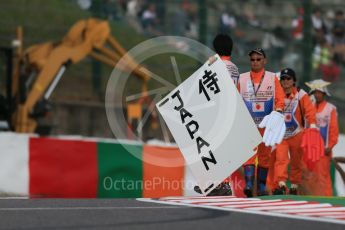 World © Octane Photographic Ltd. Marshals. Saturday 26th September 2015, F1 Japanese Grand Prix, Qualifying, Suzuka. Digital Ref: