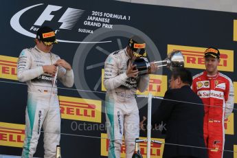 World © Octane Photographic Ltd. Mercedes AMG Petronas F1 W06 Hybrid – Lewis Hamilton (1st), Nico Rosberg (2nd) and Scuderia Ferrari SF15-T– Sebastian Vettel (3rd). Sunday 27th September 2015, F1 Japanese Grand Prix, Podium, Suzuka. Digital Ref: