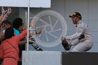 World © Octane Photographic Ltd. Mercedes AMG Petronas F1 W06 Hybrid – Lewis Hamilton (1st). Sunday 27th September 2015, F1 Japanese Grand Prix, Podium, Suzuka. Digital Ref: