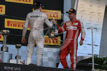 World © Octane Photographic Ltd. Mercedes AMG Petronas F1 W06 Hybrid – Nico Rosberg (2nd) and Scuderia Ferrari SF15-T– Sebastian Vettel (3rd). Sunday 27th September 2015, F1 Japanese Grand Prix, Podium, Suzuka. Digital Ref: