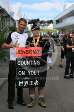 World © Octane Photographic Ltd. McLaren Honda MP4/30 - Jenson Button and fan in the paddock. Saturday 26th September 2015, F1 Japanese Grand Prix, Paddock, Suzuka. Digital Ref: 1445CB5D1828