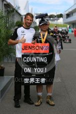 World © Octane Photographic Ltd. McLaren Honda MP4/30 - Jenson Button and fan in the paddock. Saturday 26th September 2015, F1 Japanese Grand Prix, Paddock, Suzuka. Digital Ref: 1445CB5D1835