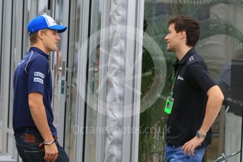 World © Octane Photographic Ltd. Sauber F1 Team C34-Ferrari – Marcus Ericsson and Lotus F1 Team Reserve Driver – Jolyon Palmer discussing Marcus' big slide yesterday. Sunday 27th September 2015, F1 Japanese Grand Prix, Setup, Suzuka. Digital Ref: 1448CB7D7877