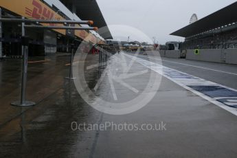 World © Octane Photographic Ltd. Wet pit lane. Thursday 24th September 2015, F1 Japanese Grand Prix, Setup, Suzuka. Digital Ref: 1439CB1D9277
