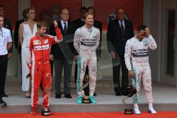 World © Octane Photographic Ltd. Mercedes AMG Petronas F1 W06 Hybrid – Nico Rosberg, Scuderia Ferrari SF15-T– Sebastian Vettel and Lewis Hamilton. Sunday 24th May 2015, F1 Race - Podium, Monte Carlo, Monaco. Digital Ref: 1287CB7D8233