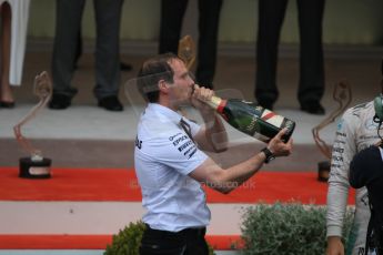 World © Octane Photographic Ltd. Mercedes AMG Petronas F1 team member enjoys some of Nico Rosbergs Champagne. Sunday 24th May 2015, F1 Race - Podium, Monte Carlo, Monaco. Digital Ref: 1287CB7D8309