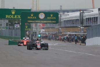 World © Octane Photographic Ltd. McLaren Honda MP4/30 - Jenson Button and Scuderia Ferrari SF15-T– Sebastian Vettel. . Friday 5th June 2015, F1 Canadian GP Practice 1, Circuit Gilles Villeneuve, Montreal, Canada. Digital Ref: 1291LB1D8937