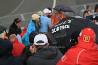 World © Octane Photographic Ltd. Fans in the grandstand with "Wet Surface" umbrella. Friday 5th June 2015, F1 Practice 2, Circuit Gilles Villeneuve, Montreal, Canada. Digital Ref: 1292LB1D0329