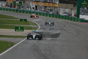 World © Octane Photographic Ltd. Mercedes AMG Petronas F1 W06 Hybrid – Lewis Hamilton and then the Scuderia Ferrari SF15-Tof Kimi Raikkonen. Sunday 7th June 2015, F1 Canadian GP Race, Circuit Gilles Villeneuve, Montreal, Canada. Digital Ref: 1299LB1D3644