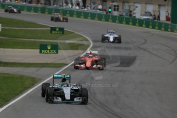 World © Octane Photographic Ltd. Mercedes AMG Petronas F1 W06 Hybrid – Lewis Hamilton, Nico Rosberg and then the Scuderia Ferrari SF15-T of Kimi Raikkonen. Sunday 7th June 2015, F1 Canadian GP Race, Circuit Gilles Villeneuve, Montreal, Canada. Digital Ref: 1299LB1D3651