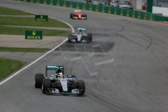 World © Octane Photographic Ltd. Mercedes AMG Petronas F1 W06 Hybrid – Lewis Hamilton and then the Scuderia Ferrari SF15-T of Kimi Raikkonen. Sunday 7th June 2015, F1 Canadian GP Race, Circuit Gilles Villeneuve, Montreal, Canada. Digital Ref: 1299LB1D3695