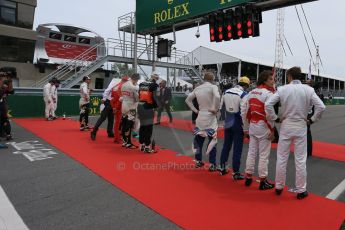 World © Octane Photographic Ltd. The drivers getting ready for the playing of teh national anthem. Sunday 7th June 2015, F1 Canadian GP Race grid, Circuit Gilles Villeneuve, Montreal, Canada. Digital Ref: 1298LB1D3550