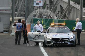 World © Octane Photographic Ltd. Charlie Whiting and Herbie Blash examining the new 12 after the new Anderson bridge layout change. Friday 18th September 2015, F1 Singapore Grand Prix Practice 1, Marina Bay. Digital Ref: 1428LB1L9638
