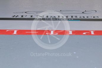 World © Octane Photographic Ltd. Mercedes AMG Petronas F1 W06 Hybrid pit marking– Lewis Hamilton. Saturday 19th September 2015, F1 Singapore Grand Prix Pit lane, Marina Bay. Digital Ref: 1432CB7D1367