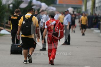 World © Octane Photographic Ltd. Ferrari and Renault personnel in teh paddock. Friday 18th September 2015, F1 Singapore Grand Prix Paddock, Marina Bay. Digital Ref: 1427CB1D4468