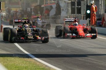 World © Octane Photographic Ltd. Scuderia Ferrari SF15-T– Sebastian Vettel and Lotus F1 Team E23 Hybrid – Pastor Maldonado.  Friday 8th May 2015, F1 Spanish GP Practice 1, Circuit de Barcelona-Catalunya, Spain. Digital Ref: 1249CB1L6077