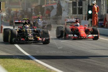World © Octane Photographic Ltd. Scuderia Ferrari SF15-T– Sebastian Vettel and Lotus F1 Team E23 Hybrid – Pastor Maldonado. Friday 8th May 2015, F1 Spanish GP Practice 1, Circuit de Barcelona-Catalunya, Spain. Digital Ref: 1249CB1L6077