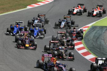 World © Octane Photographic Ltd. The pack in turn 2. Sunday 10th May 2015, F1 Spanish GP Formula 1 Race, Circuit de Barcelona-Catalunya, Spain. Digital Ref: 1265LB1D0333